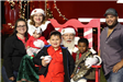 Family Posing with Santa and Mrs Claus