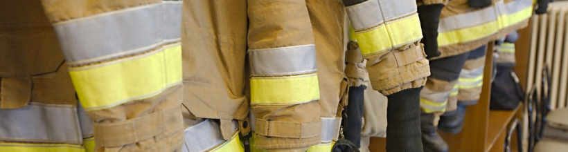 Fire Fighter Jackets Hanging in a Row